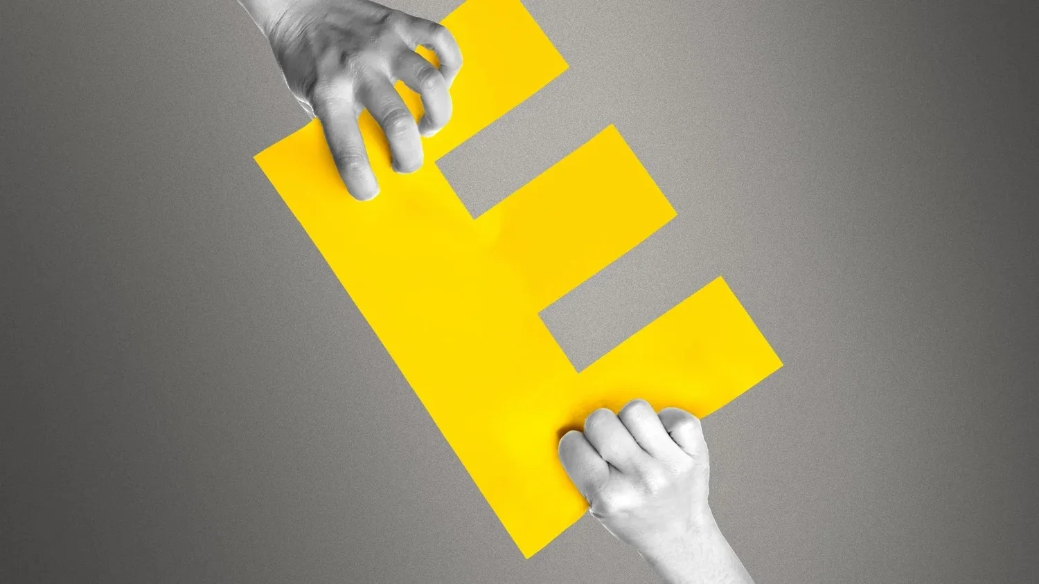 Two hands, one from the top left and the other from the bottom right, grasp a large, yellow letter 'E' against a grey background, symbolizing the tug-of-war over the concept of equity in DEI (Diversity, Equity, and Inclusion) initiatives. Credit: Annelise Capossela/Axios