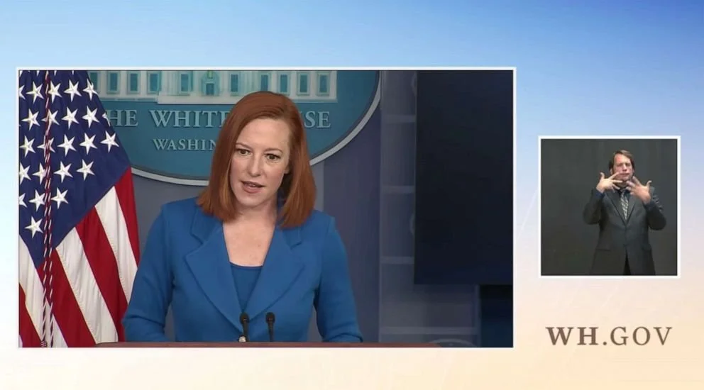 An American Sign Language interpreter provides interpretation during a White House press briefing, April 2021.