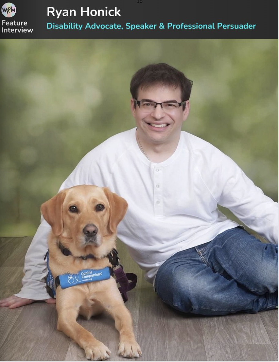 Ryan and Canine Companions Lovey pose for a photo. Ryan is wearing a white shirt and jeans. He leans against Lovey who is staring straight ahead wearing her working vest.