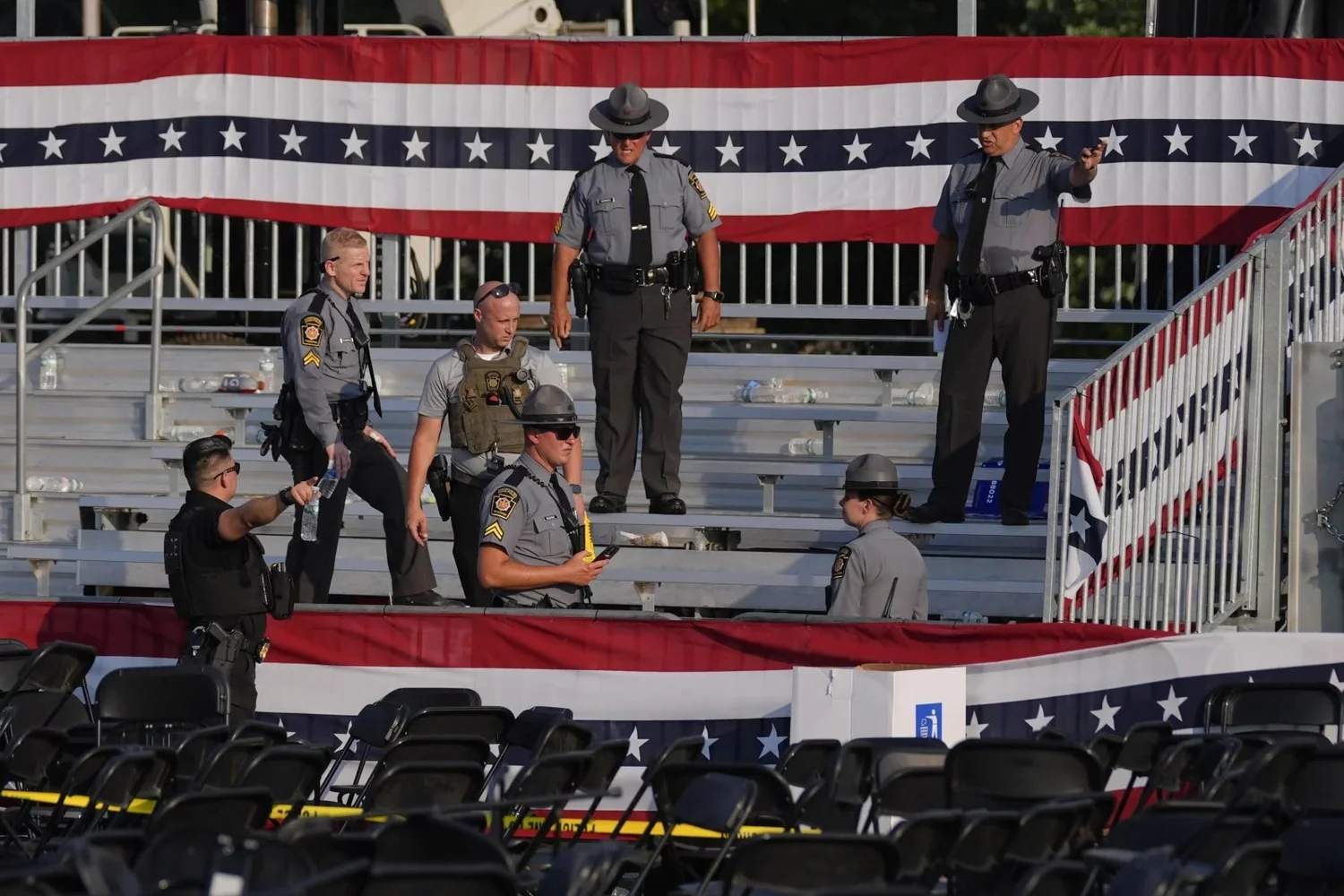 Law enforcement officers gather at the campaign rally site for Republican presidential candidate former President Trump. Evan Vucci/AP